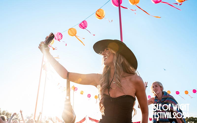Sky presents the Isle of Wight Festival 2025 Gallery - someone holding phone